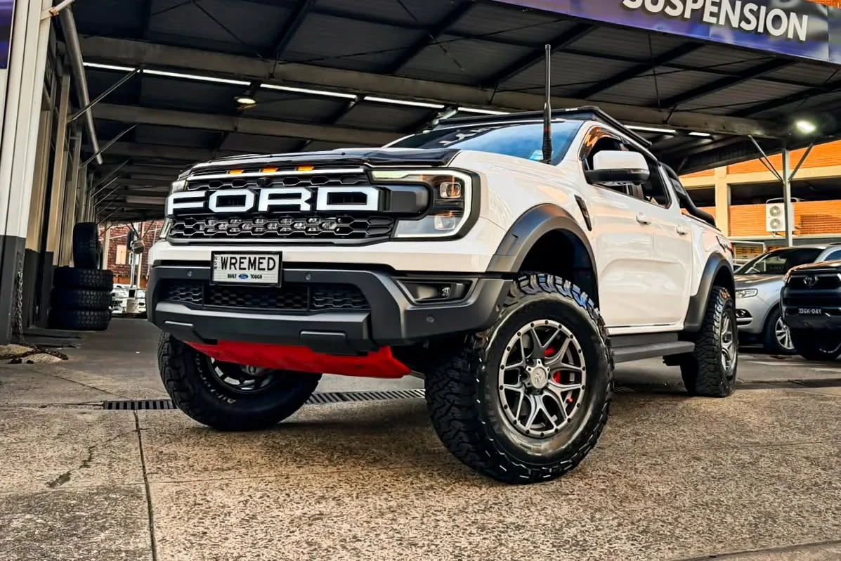 White Ford 4x4 with alloy wheels at the Rhino workshop
