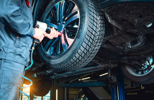 Professional tyre fitting equipment in use